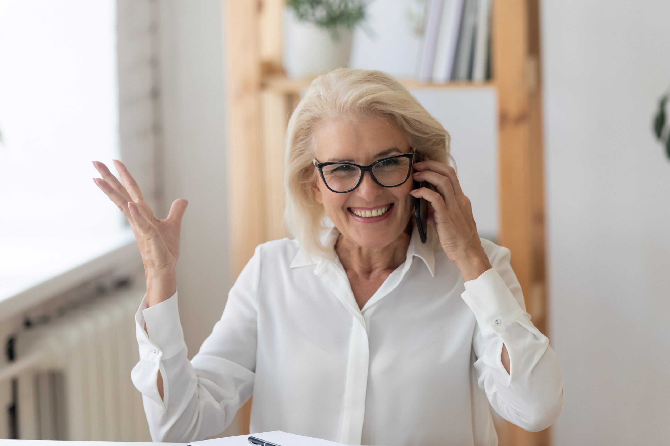 An older woman answers a personalized call from an association's membership drive designed to increase memberships.