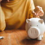 
                            A person accumulating non-dues revenue and storing that money in a piggy bank.                            