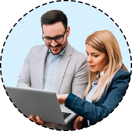 colleagues point to laptop