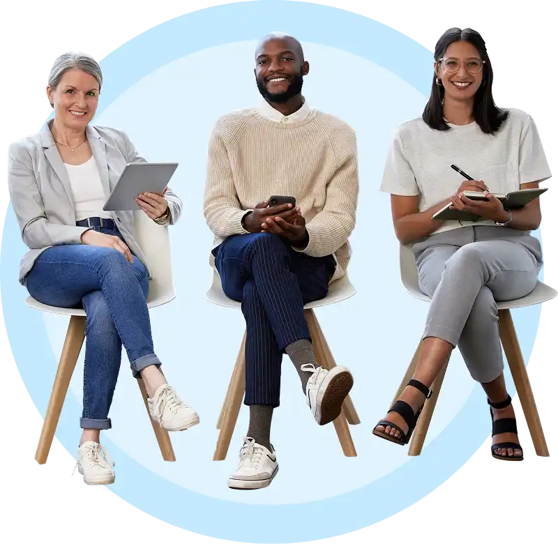 a group of three colleagues sitting on chairs