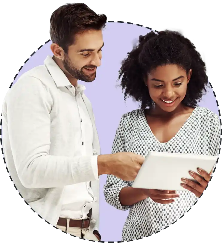 a man and woman viewing a tablet screen together