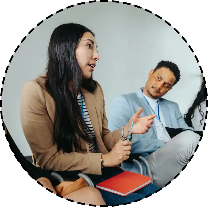 a woman speaking during an office meeting