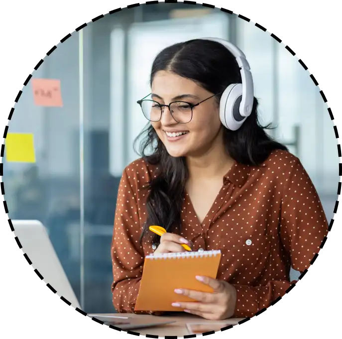 woman wearing a headset and taking notes